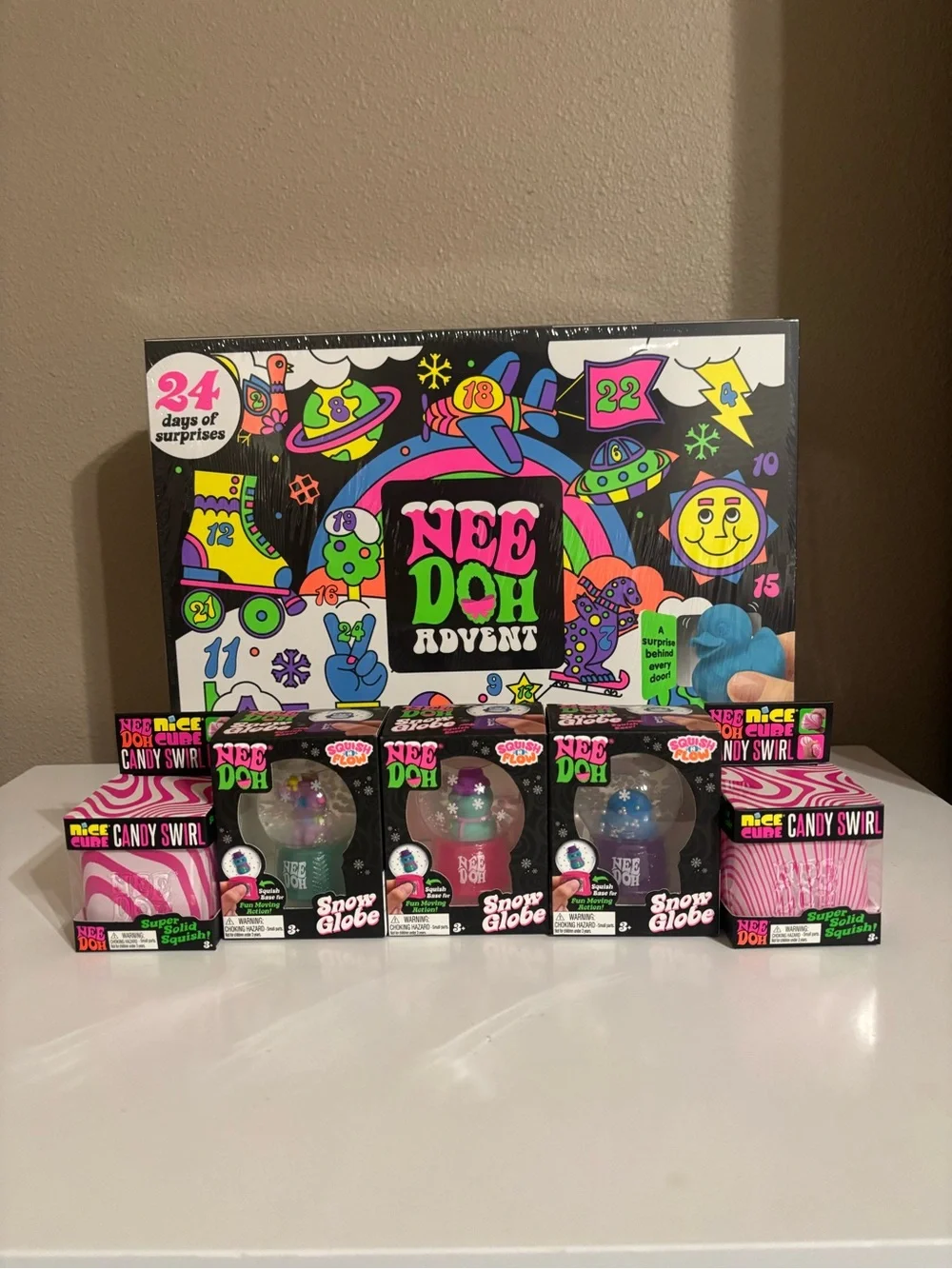 NeeDoh Advent Calendar with Candy Swirl Cubes and Snow Globes - Squishmas Bundle